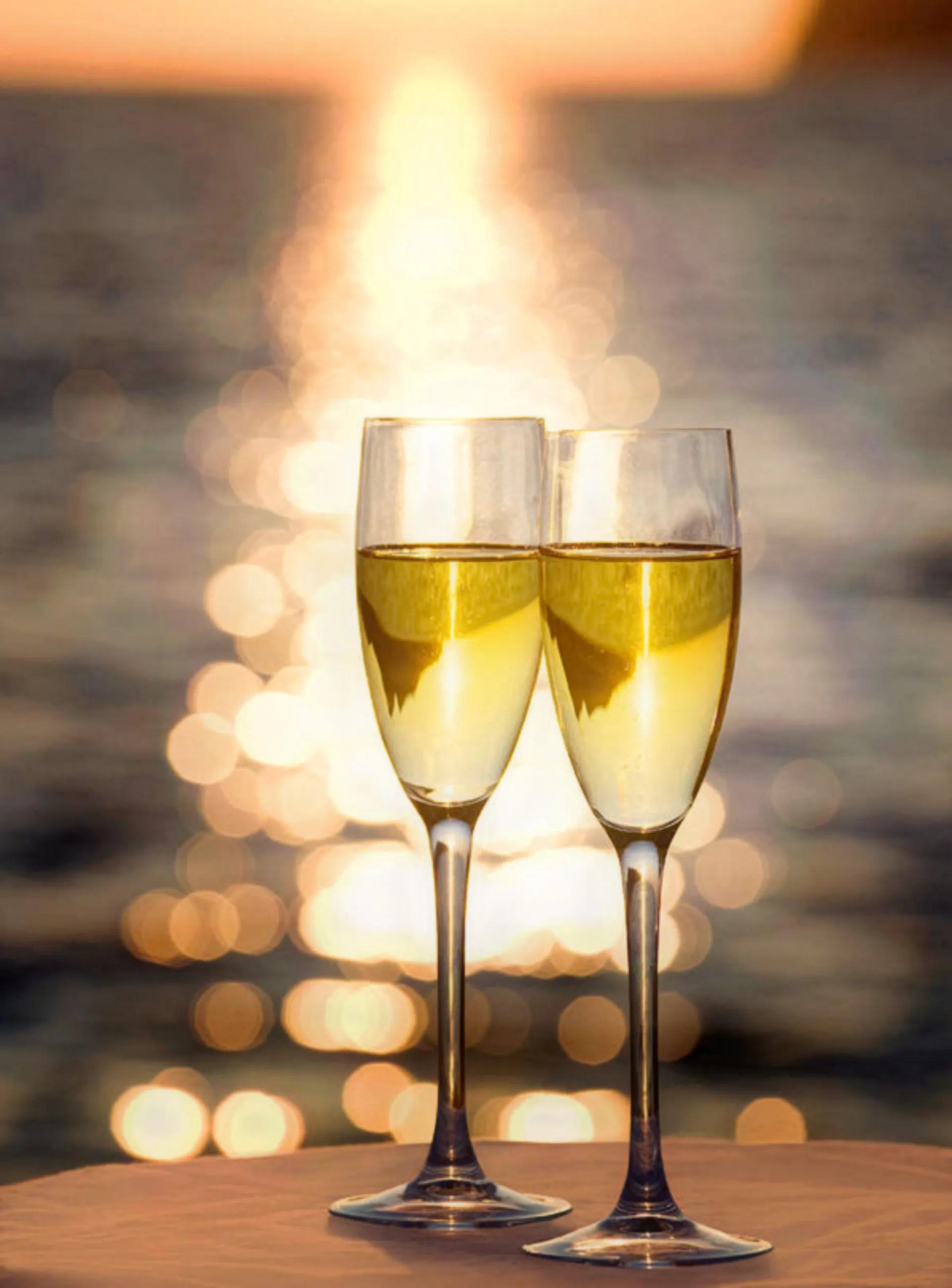 two champagne glasses at Sunset